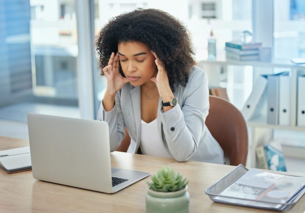 Business woman, laptop or stress headache in financial planning failure, crisis or investment fraud. Frustration, annoyed or migraine for corporate worker on technology, finance scam or phishing risk